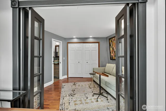a living room with furniture and a rug