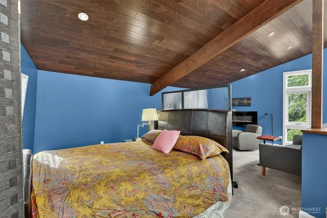 a bed room with a bed and a chair