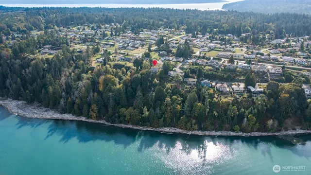 an aerial view of residential house with outdoor space and lake view