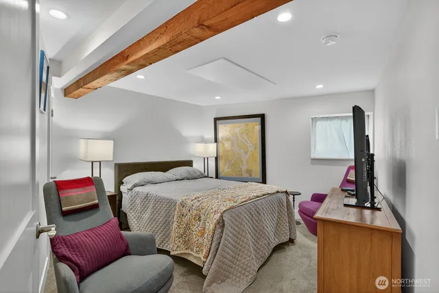 a bedroom with a bed and a couch