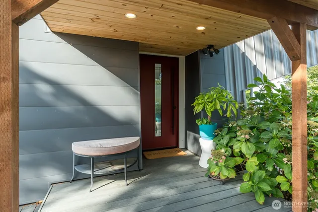 a backyard of a house with table and chairs