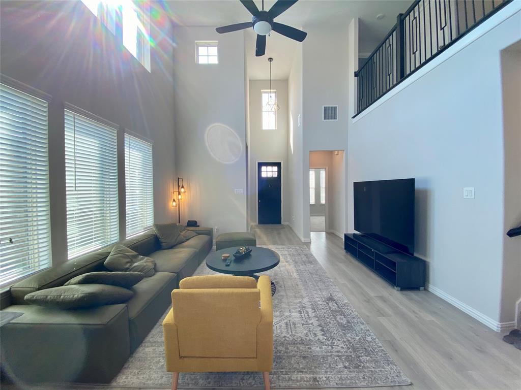 1510 Verbena Lane Garland, TX 75042 - Photo 2 of 10 a living room with furniture and a flat screen tv