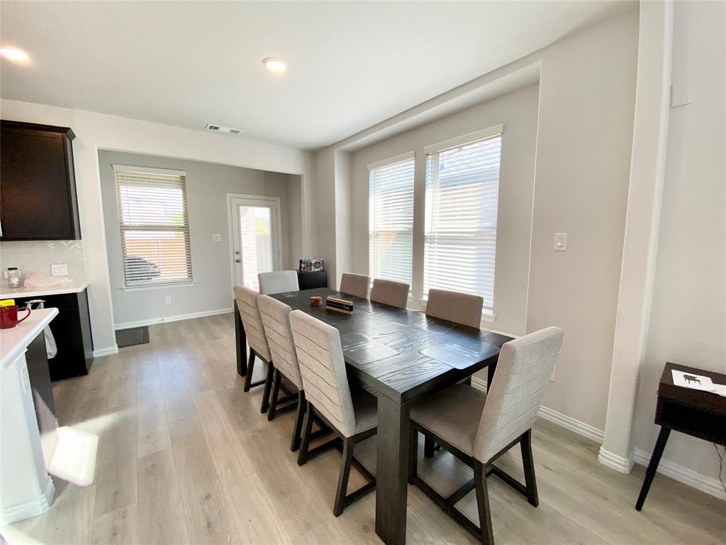 1510 Verbena Lane Garland, TX 75042 - Photo 3 of 10 a view of a a dining room with furniture window and wooden floor