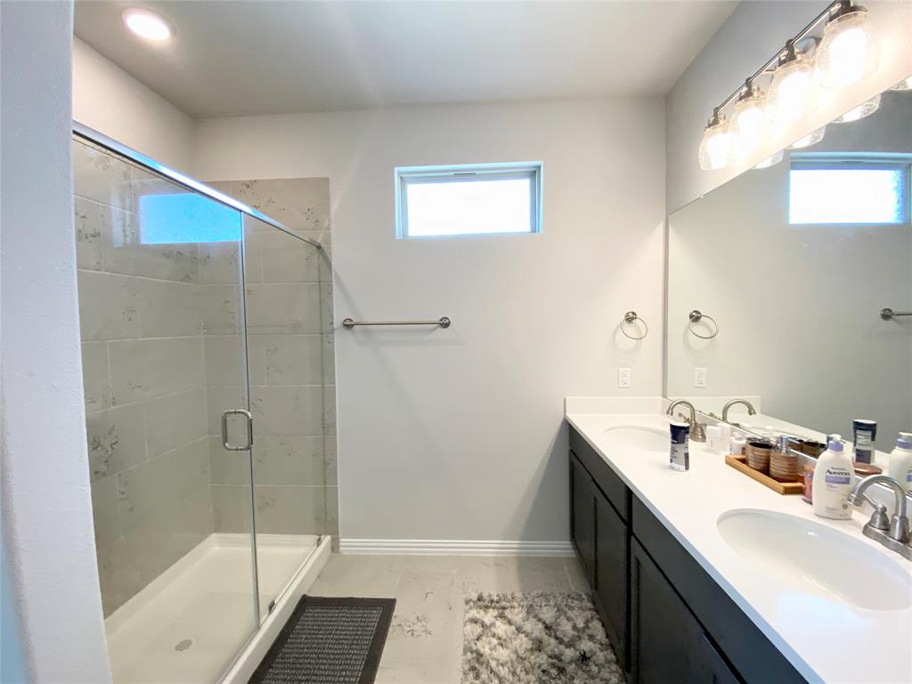 1510 Verbena Lane Garland, TX 75042 - Photo 6 of 10 a bathroom with a tub sink and shower