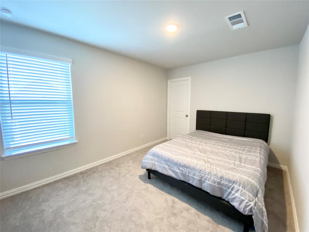 1510 Verbena Lane Garland, TX 75042 - Photo 9 of 10 a bedroom with bed and window