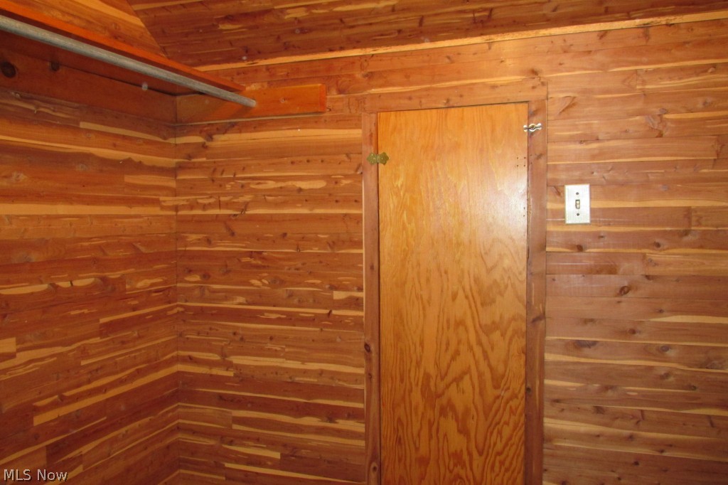 9801 Yoder Road Sterling, OH 44276 - Photo 15 of 25 Large walk-in cedar closet in the upstairs hallway has door leading to additional "attic" storage space.