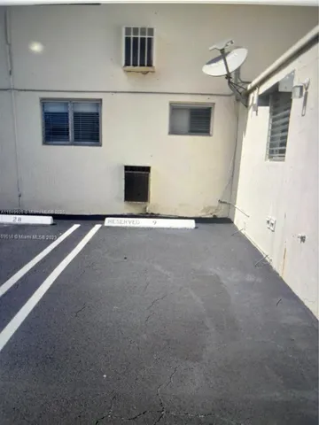 a view of an empty room with a fireplace