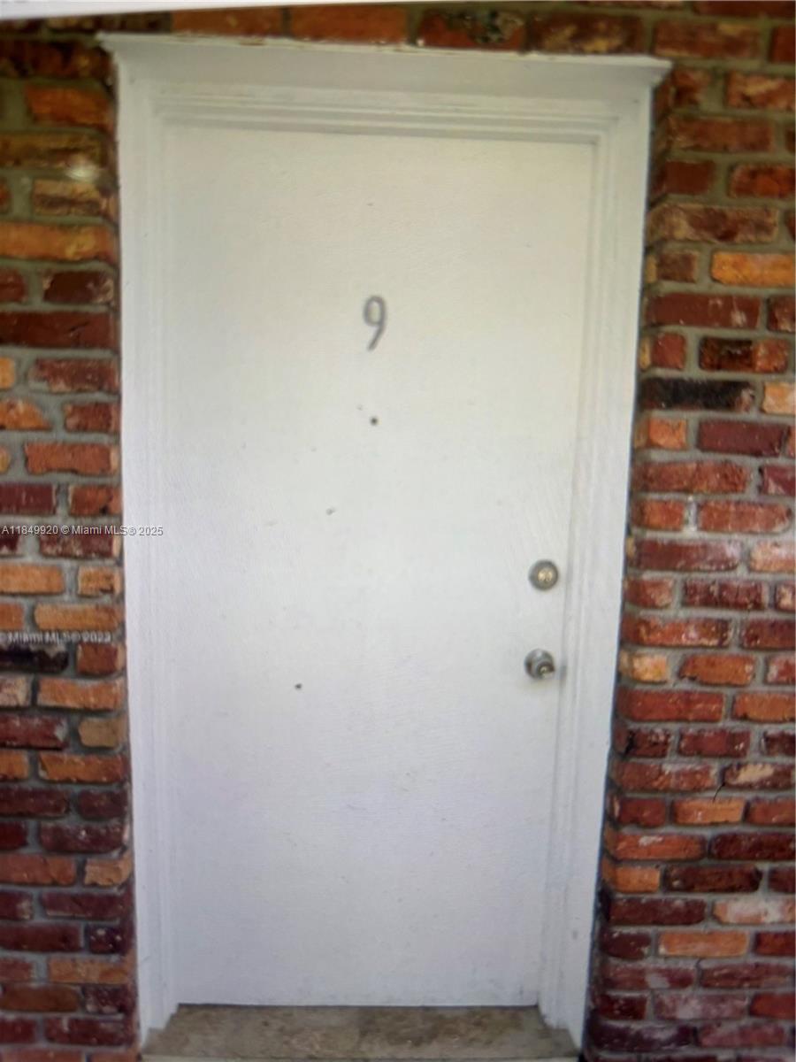 100 Sunrise Drive, Unit 9 Key Biscayne, FL 33149 - Photo 3 of 17 a view of wooden door