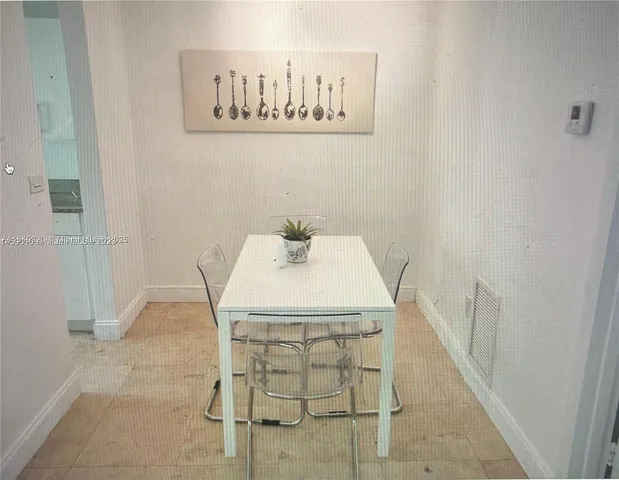 a bath room with a sink and a mirror