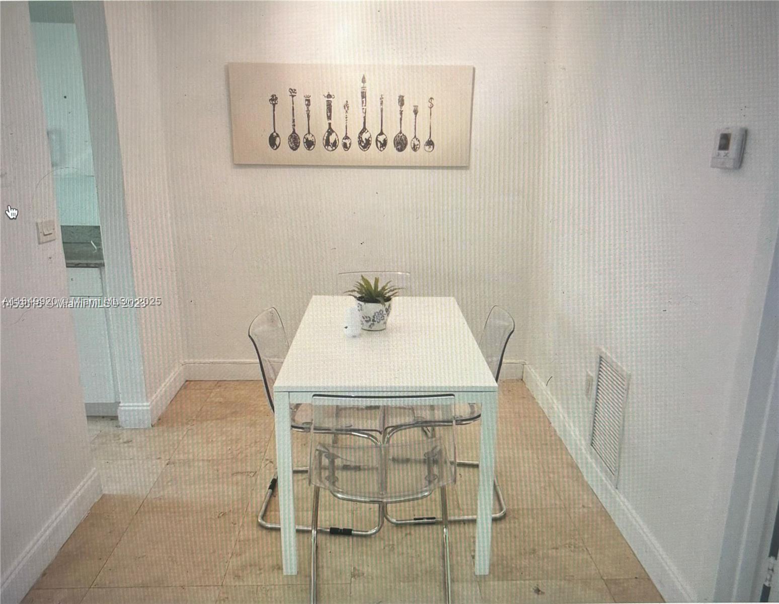 100 Sunrise Drive, Unit 9 Key Biscayne, FL 33149 - Photo 6 of 17 a bath room with a sink and a mirror