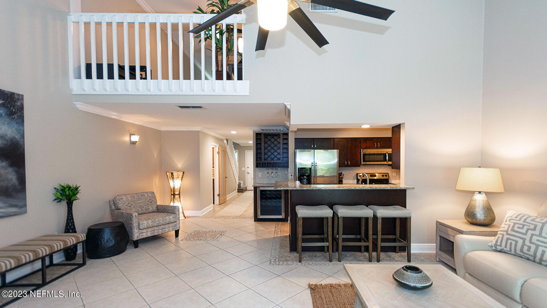 121 Sand Castle Way Neptune Beach, FL 32266 - Photo 11 of 39 a living room with furniture a window and a potted plant