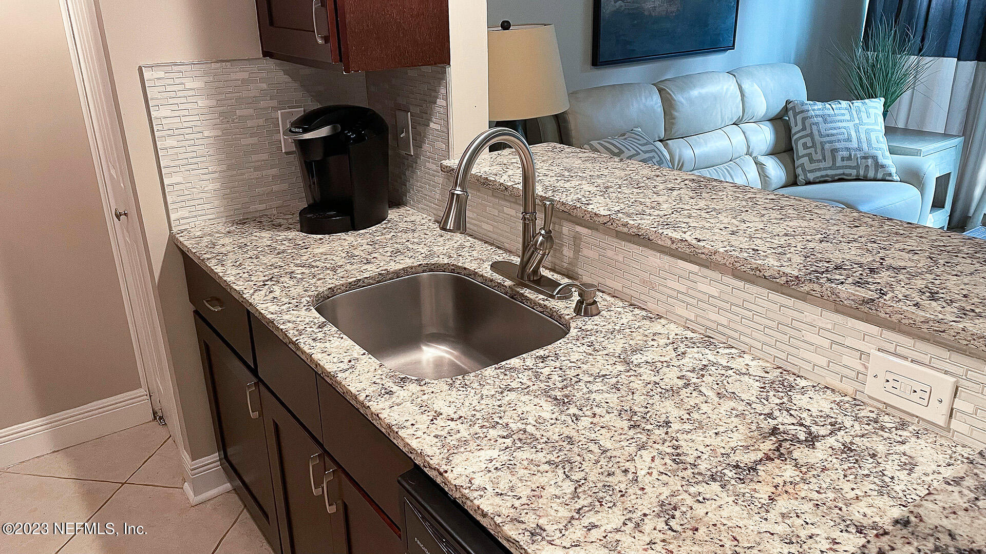 121 Sand Castle Way Neptune Beach, FL 32266 - Photo 14 of 39 a kitchen with a sink and a refrigerator