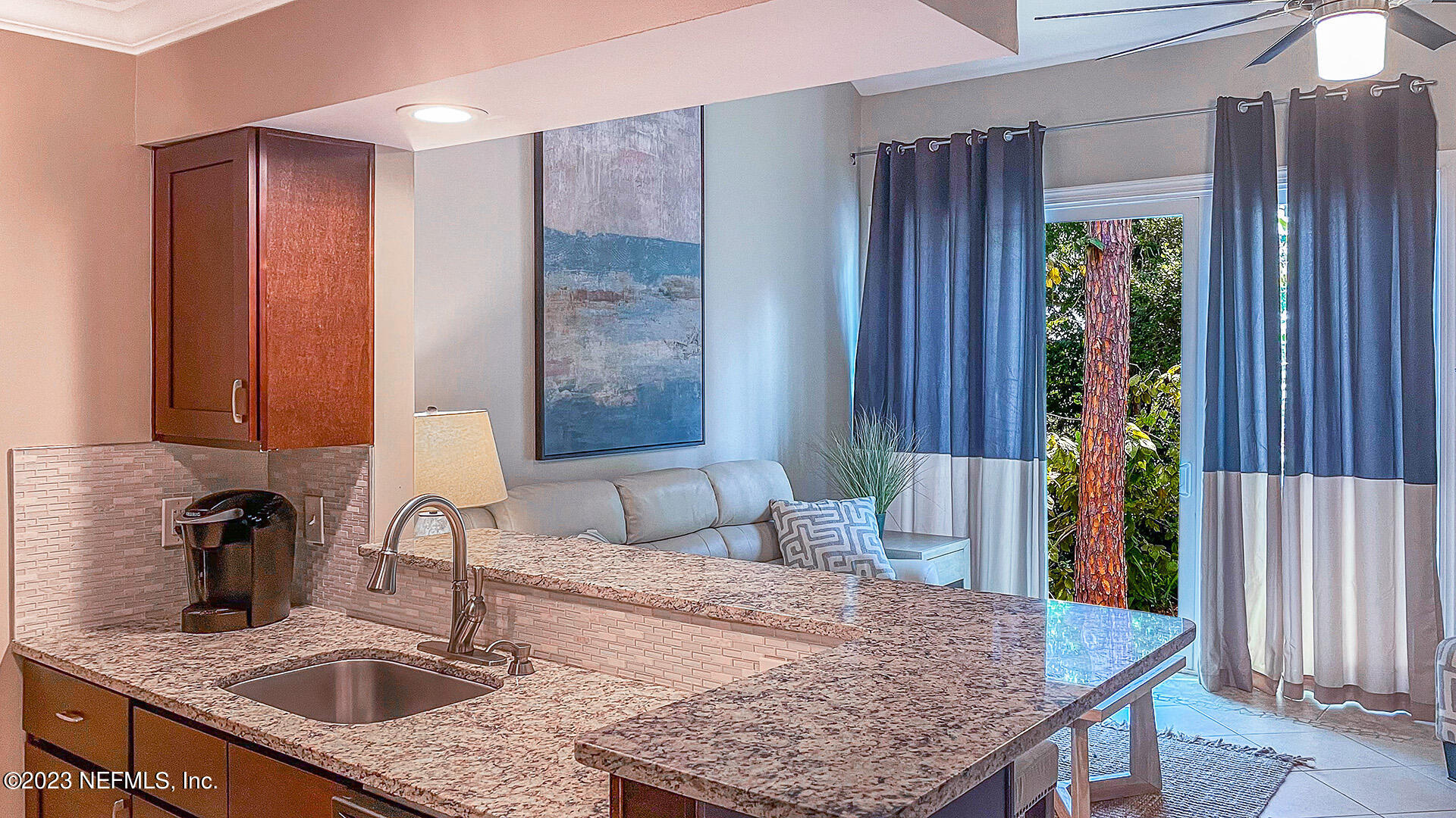 121 Sand Castle Way Neptune Beach, FL 32266 - Photo 15 of 39 a kitchen with a sink and a wooden floor