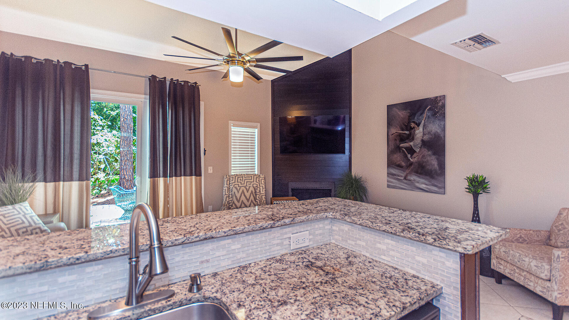 121 Sand Castle Way Neptune Beach, FL 32266 - Photo 16 of 39 a living room with furniture and a potted plant
