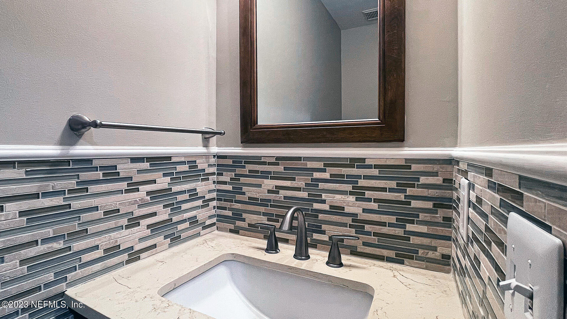 121 Sand Castle Way Neptune Beach, FL 32266 - Photo 18 of 39 a bathroom with a sink and a mirror