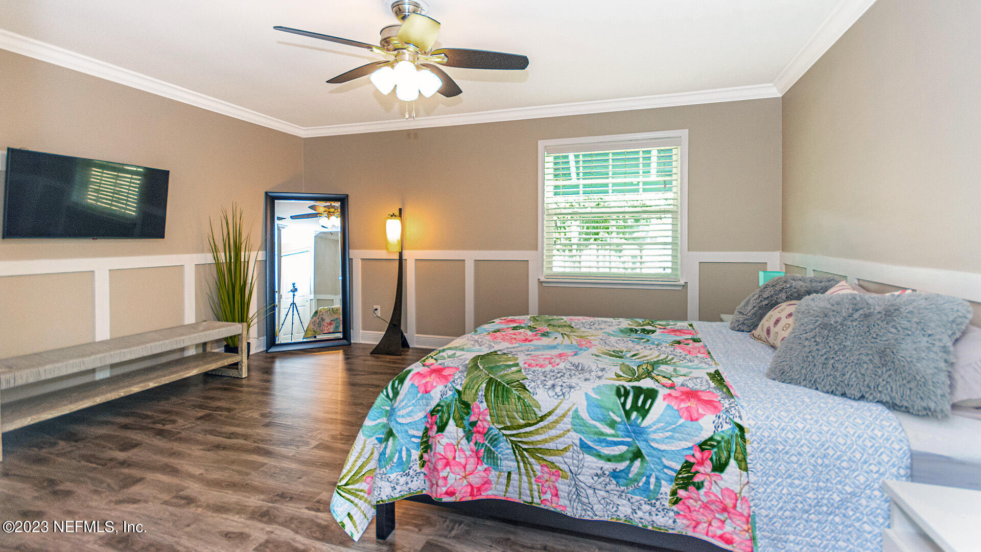 121 Sand Castle Way Neptune Beach, FL 32266 - Photo 23 of 39 a bedroom with a bed dresser and flat screen tv
