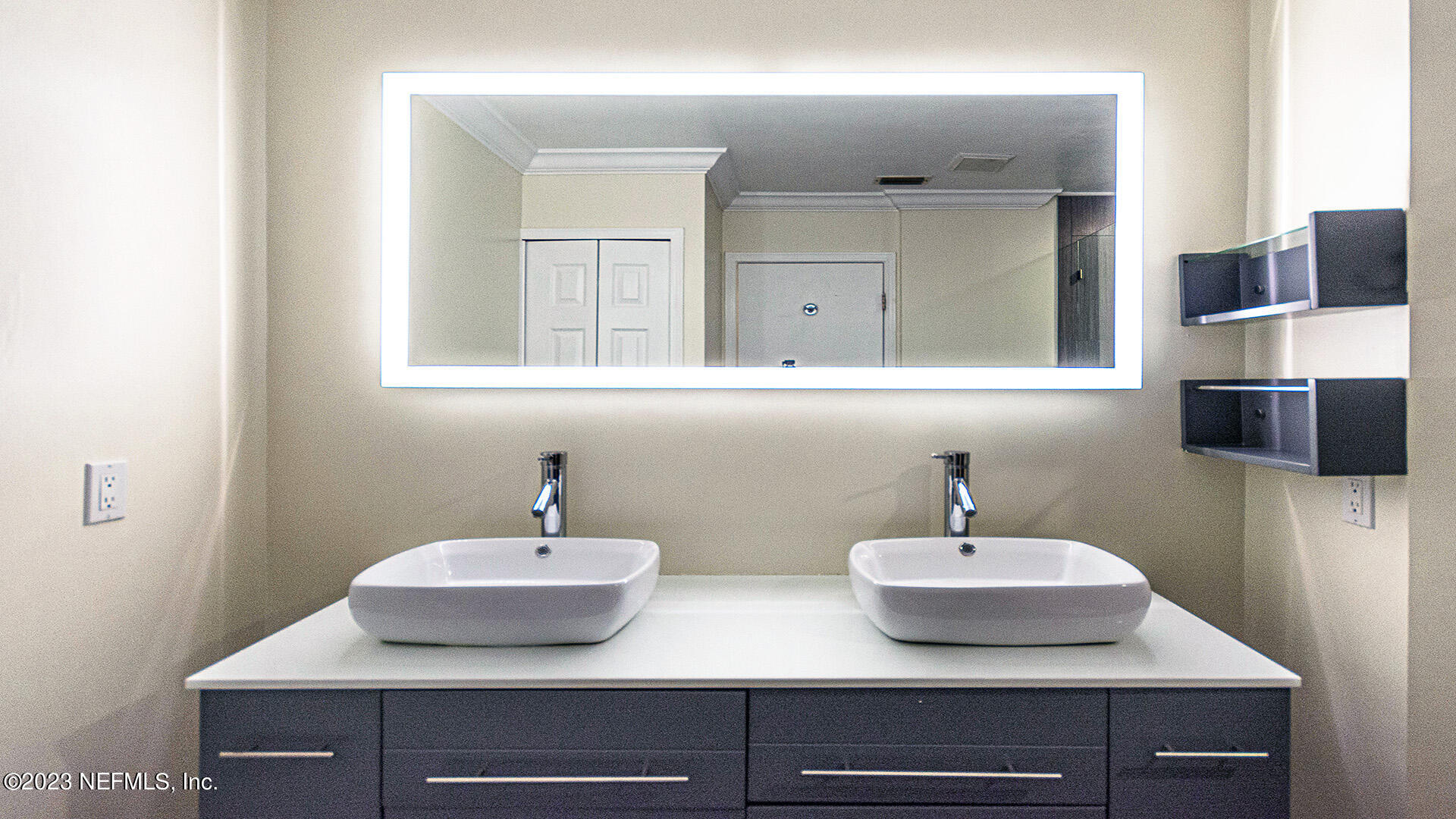 121 Sand Castle Way Neptune Beach, FL 32266 - Photo 25 of 39 a bathroom with a sink and a mirror