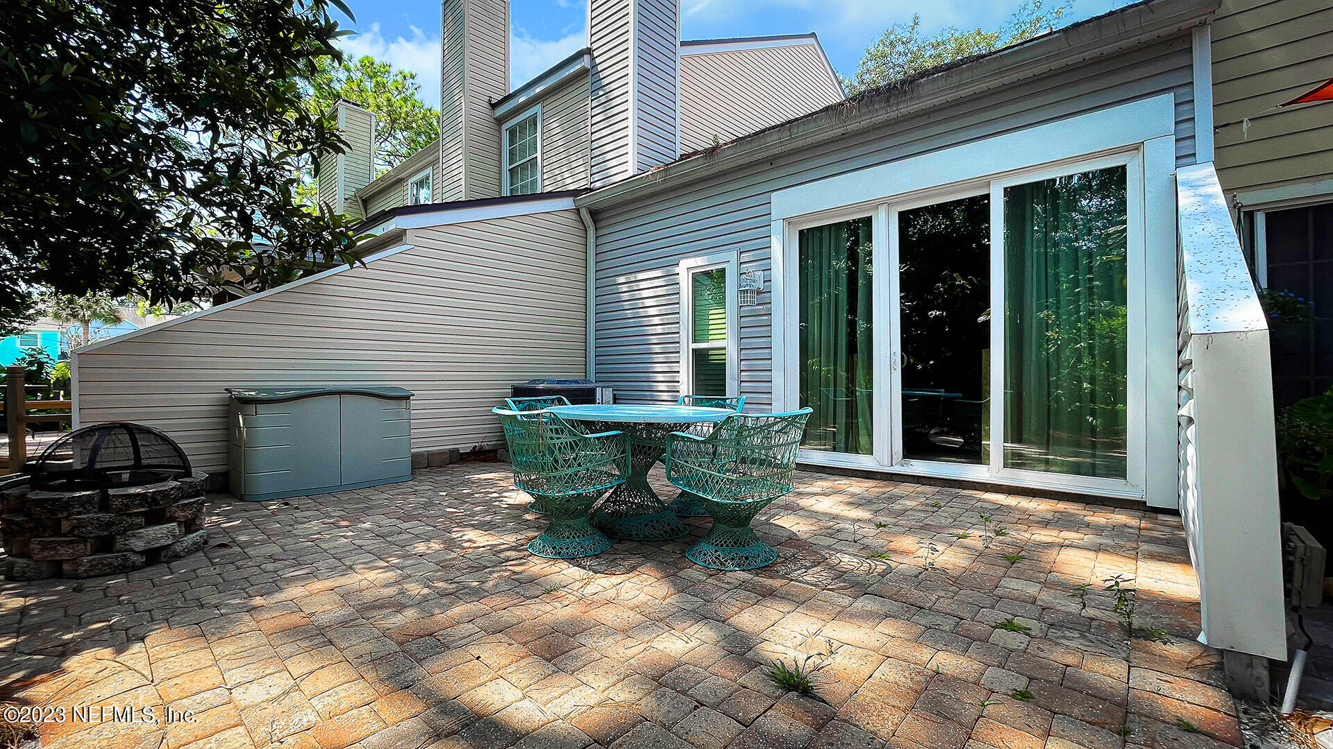 121 Sand Castle Way Neptune Beach, FL 32266 - Photo 30 of 39 a view of a house with backyard sitting area and garden