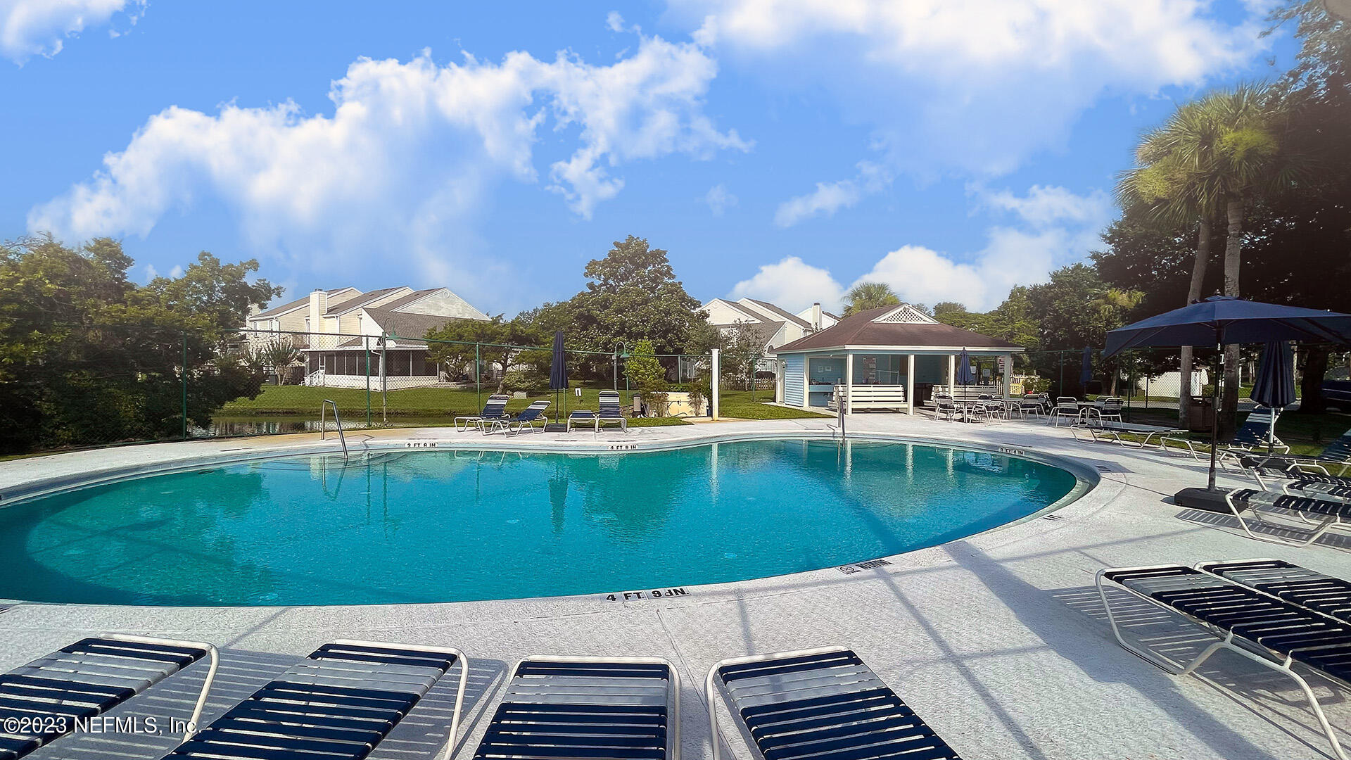121 Sand Castle Way Neptune Beach, FL 32266 - Photo 35 of 39 a view of a swimming pool with a patio
