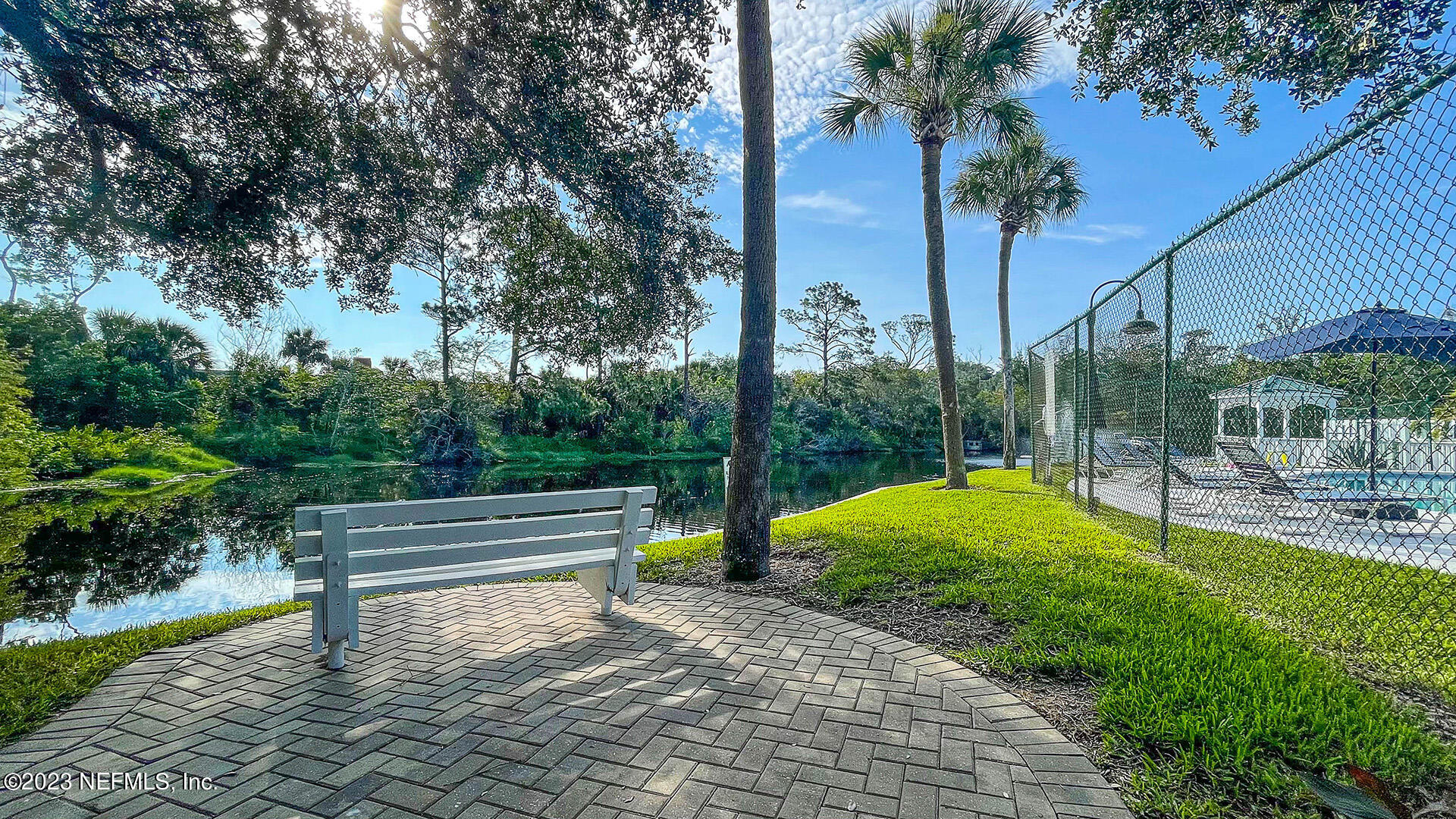 121 Sand Castle Way Neptune Beach, FL 32266 - Photo 38 of 39 a view of a backyard with couches with wooden fence and plants