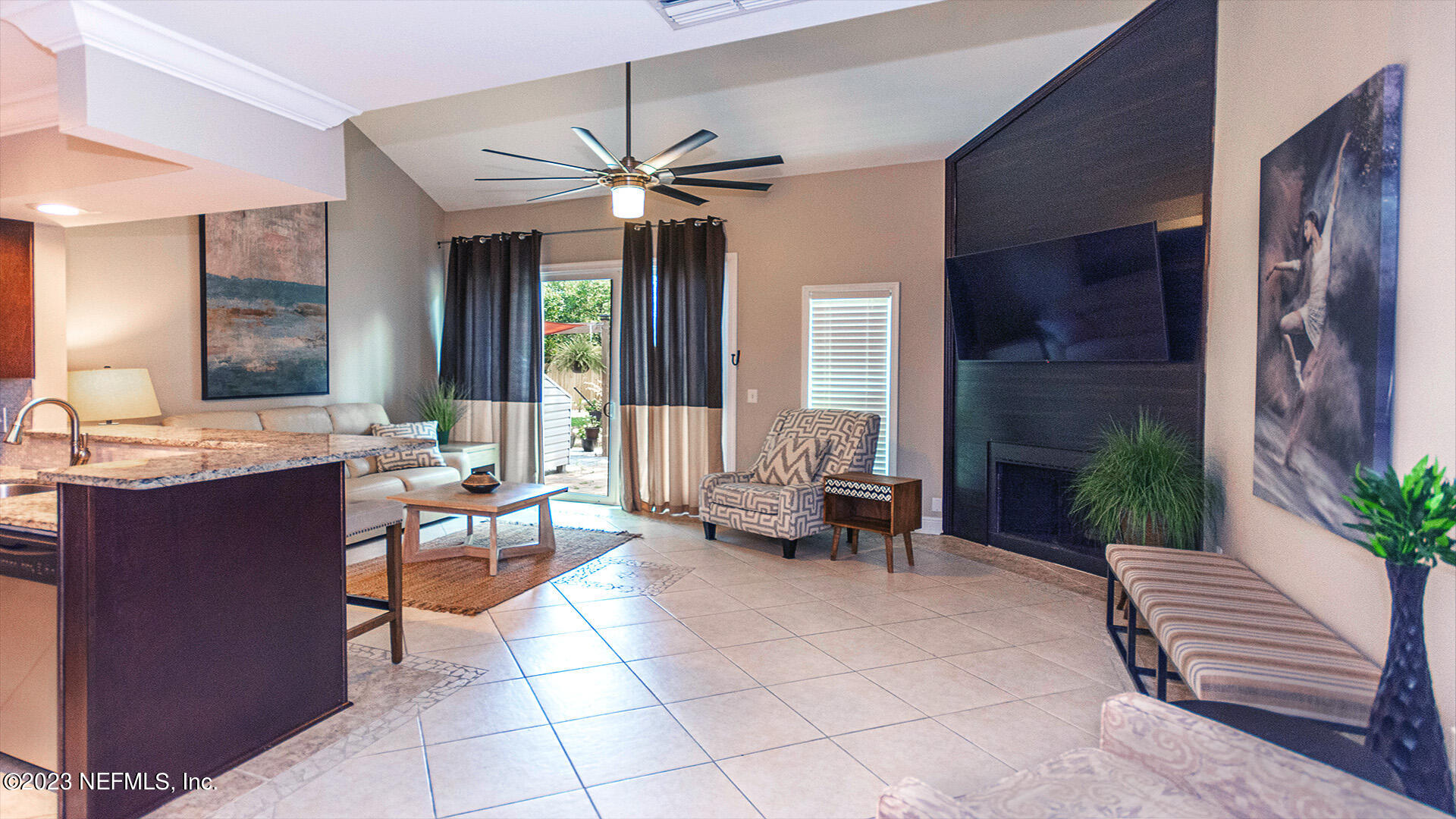 121 Sand Castle Way Neptune Beach, FL 32266 - Photo 7 of 39 a living room with furniture and a large window