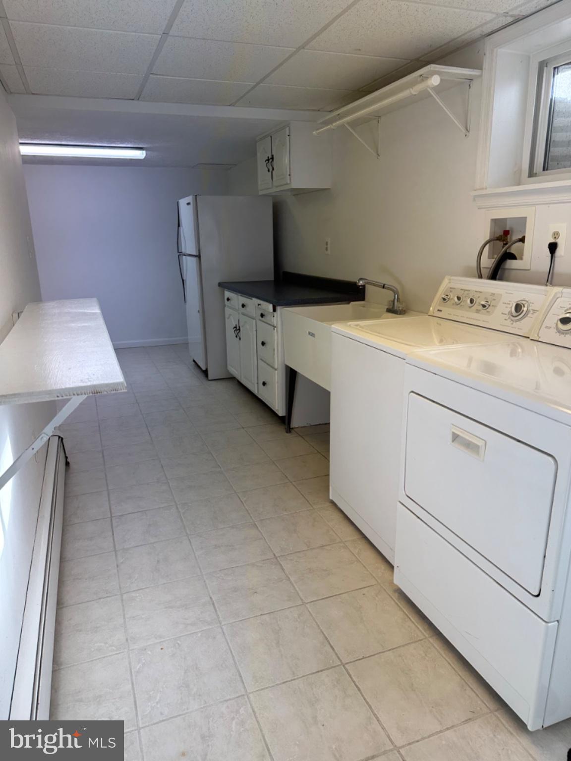 14616 Sturtevant Road Silver Spring, MD 20905 - Photo 28 of 44 Bright and functional laundry space.