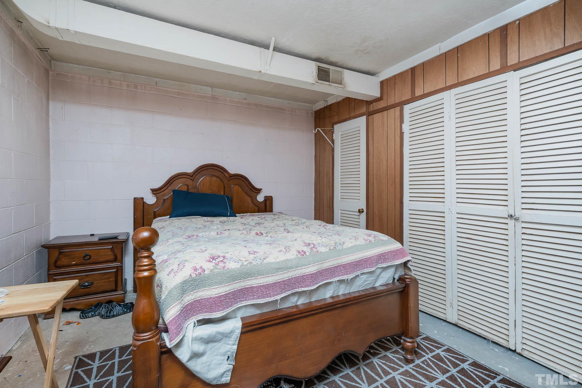 3322 Friar Tuck Road Raleigh, NC 27610 - Photo 14 of 20 a bedroom with a bed and a window