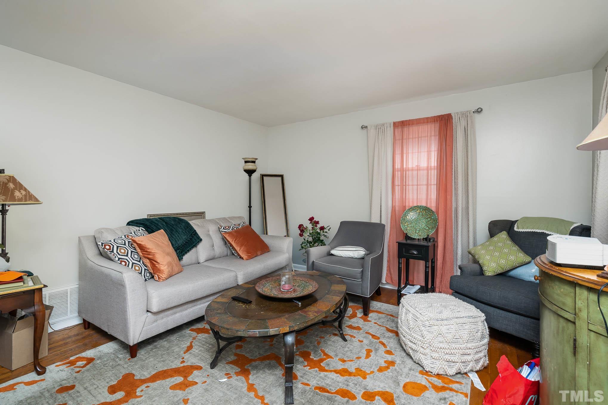 3322 Friar Tuck Road Raleigh, NC 27610 - Photo 5 of 20 a living room with furniture and wooden floor