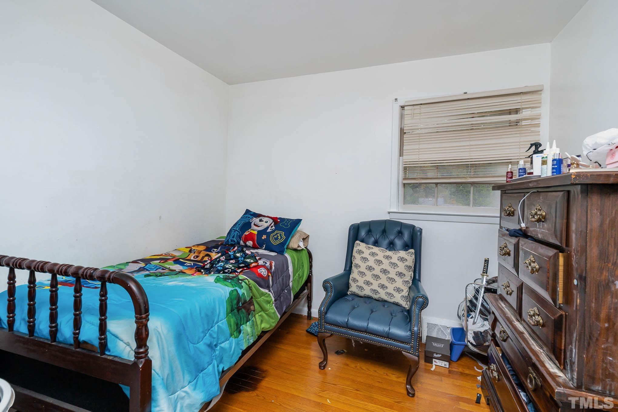 3322 Friar Tuck Road Raleigh, NC 27610 - Photo 10 of 20 a bedroom with furniture and a window