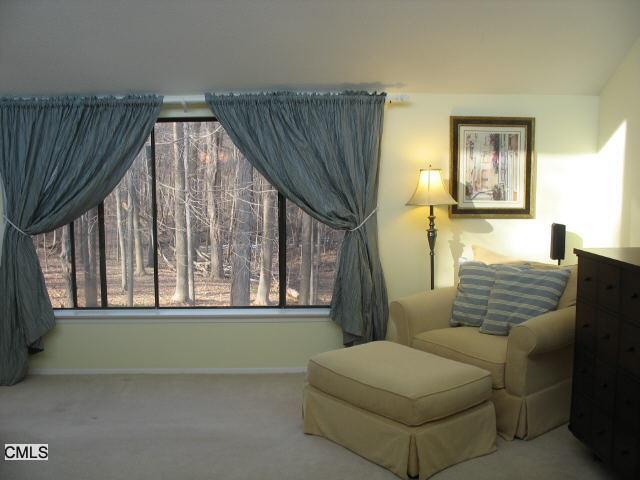 8 Melon Lane Ridgefield, CT 06877 - Photo 1 of 1 a living room with furniture and a window