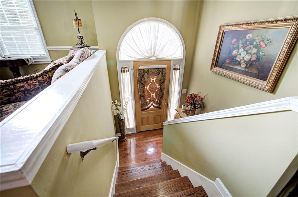 218 Gilreath Road Southeast Cartersville, GA 30121 - Photo 4 of 27 a view of a hallway with wooden floor and staircase