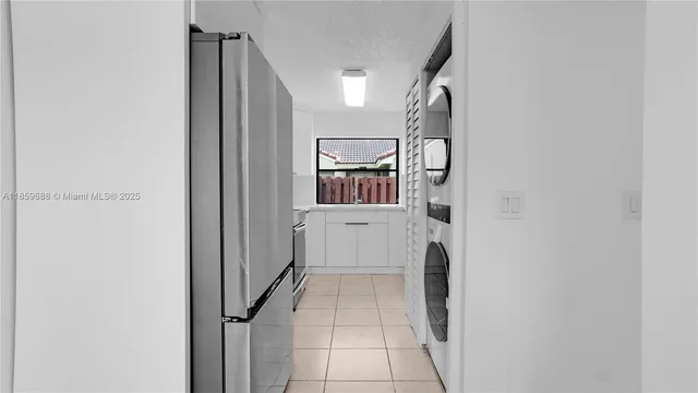 a view of a kitchen with washer and dryer
