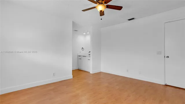a bathroom with a sink a mirror and shower