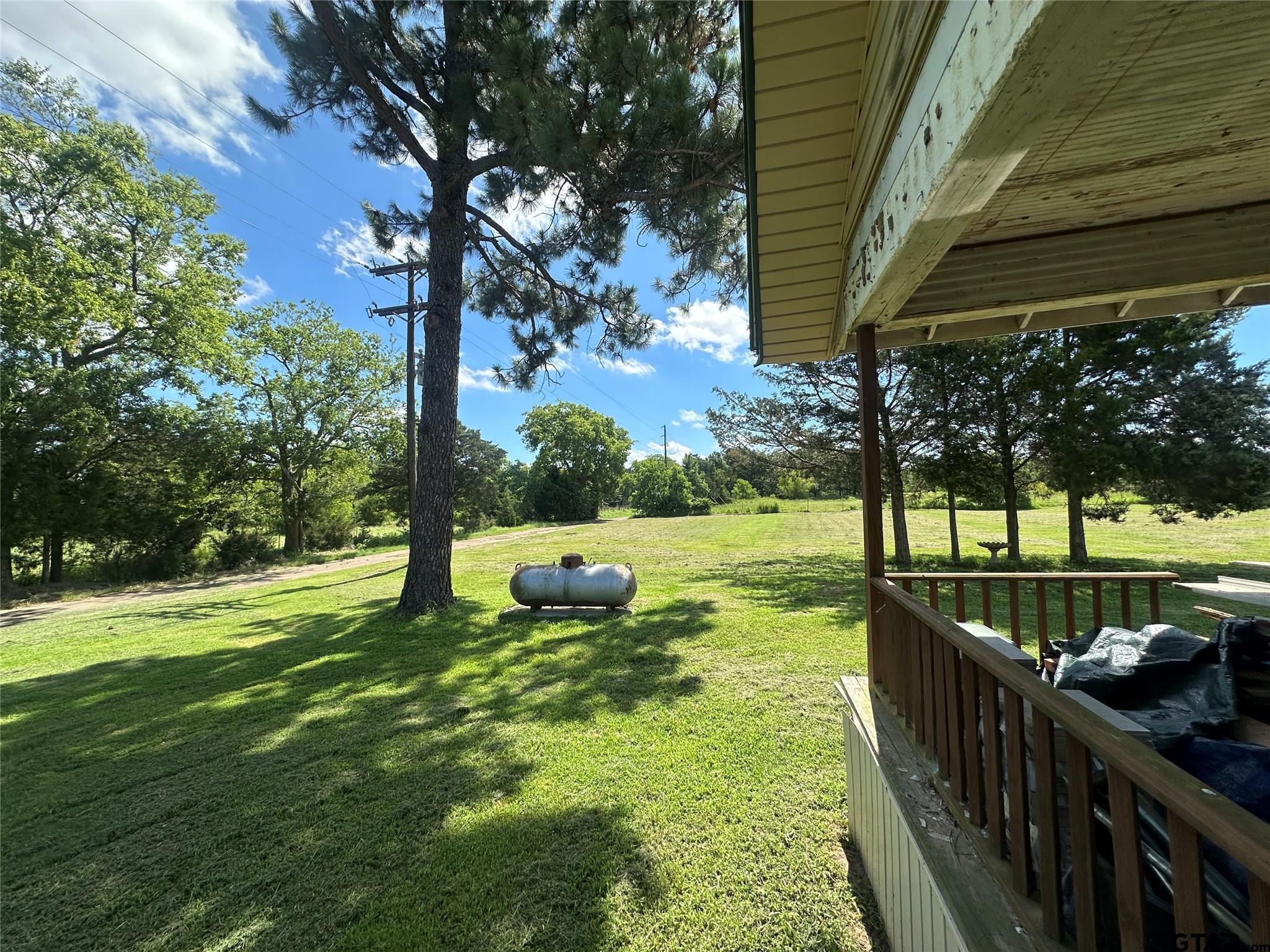 528 County Road 1830 Yantis, TX 75497 - Photo 2 of 13 a view of a deck with a backyard