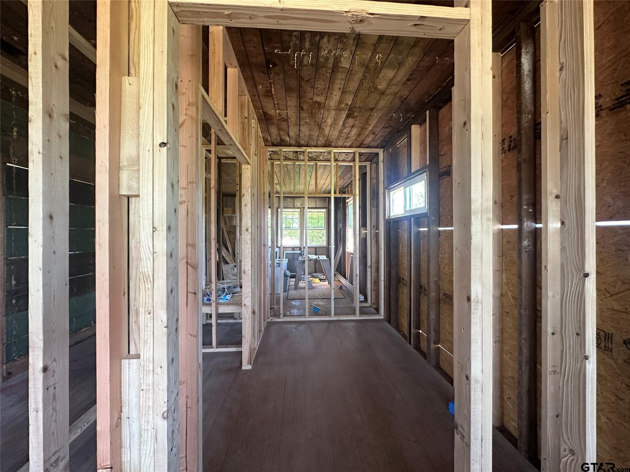 528 County Road 1830 Yantis, TX 75497 - Photo 10 of 13 a view of a hallway with wooden floor and door