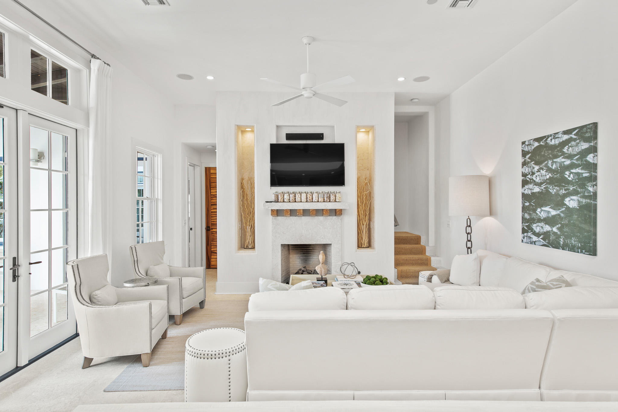 86 North Charles Street, Unit B9 Inlet Beach, FL 32461 - Photo 28 of 60 a living room with furniture a fireplace and a flat screen tv
