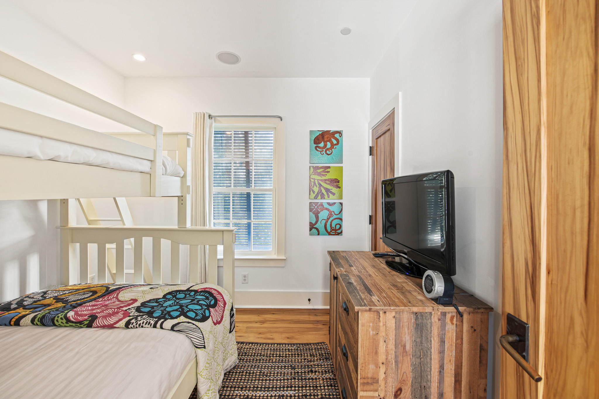 86 North Charles Street, Unit B9 Inlet Beach, FL 32461 - Photo 52 of 60 a bedroom with a bed and flat screen tv