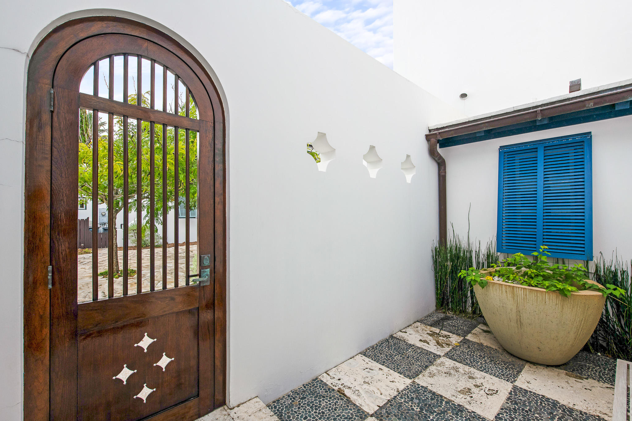 86 North Charles Street, Unit B9 Inlet Beach, FL 32461 - Photo 8 of 60 a room with wooden door and a potted plant
