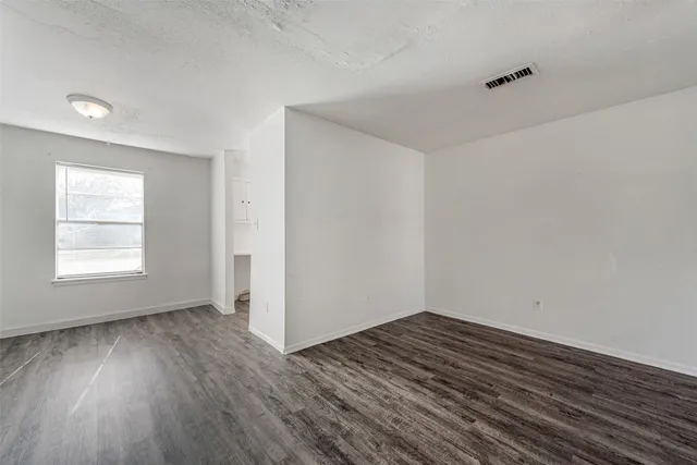 a kitchen with sink a window and stainless steel appliances