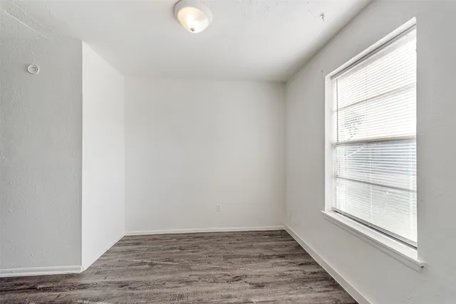 a kitchen with a sink cabinets and window