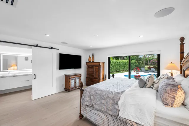 a bathroom with a granite countertop toilet and a sink