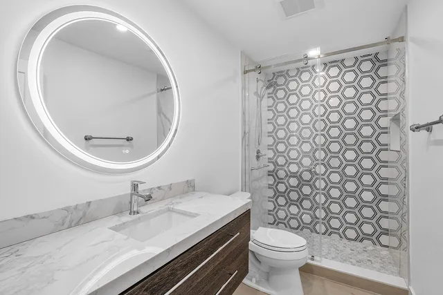 a view of a storage and utility room with washer and dryer