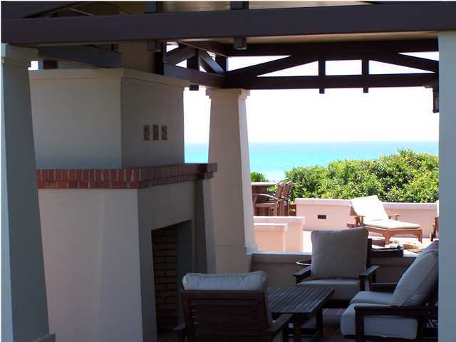Undisclosed Address Santa Rosa Beach, FL 32459 - Photo 4 of 25 a outdoor living space with furniture and a fireplace