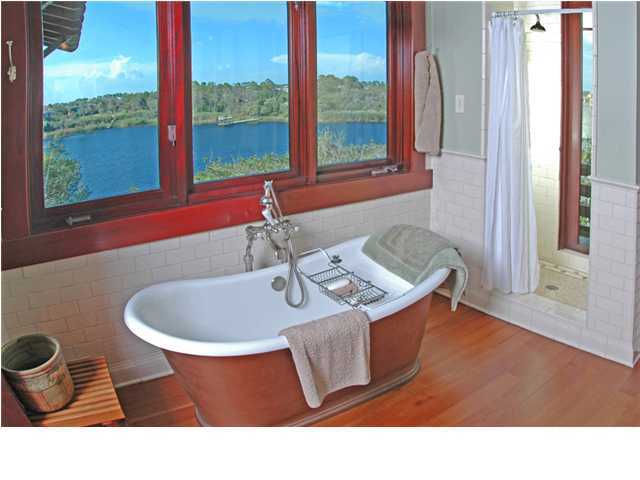 Undisclosed Address Santa Rosa Beach, FL 32459 - Photo 9 of 25 a bathroom with a sink and a mirror