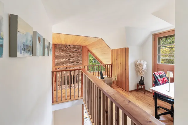 a view of a balcony and wooden floor