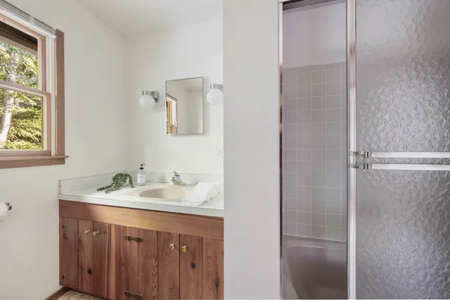 a bathroom with a sink and a mirror