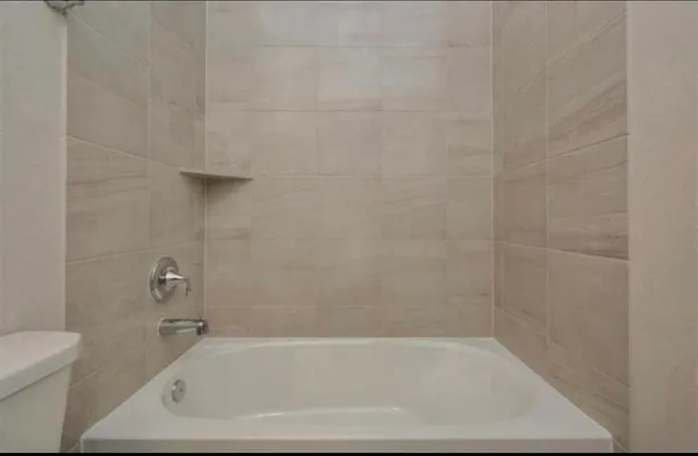 a close up of a bathtub curtain