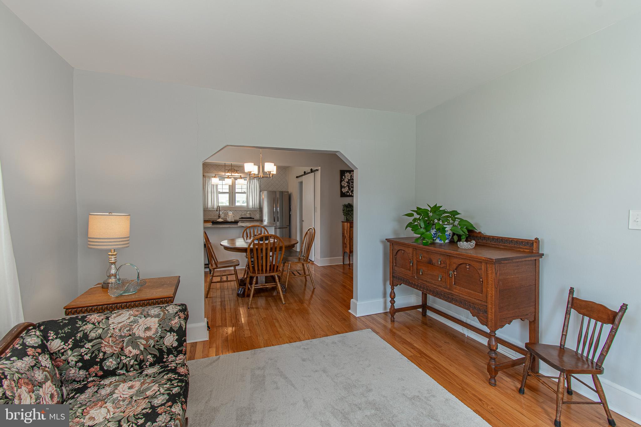 207 Crusader Road Cambridge, MD 21613 - Photo 19 of 76 a living room with furniture and a dining room