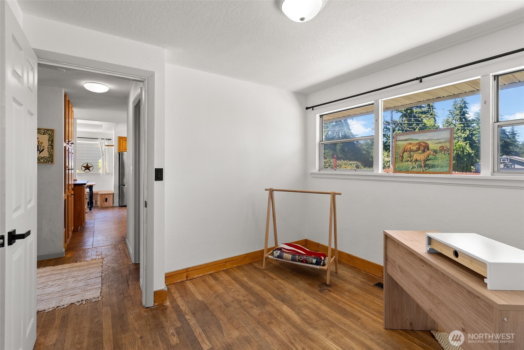 2710 Holman Street Bremerton, WA 98310 - Photo 13 of 25 a view of a bedroom with wooden floor and a window