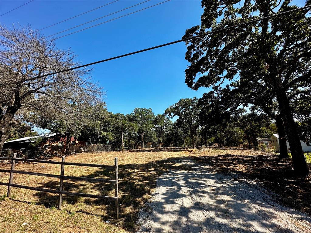 7347 Remington Road Mansfield, TX 76063 - Photo 3 of 8 a view of a park with large trees